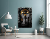 African Woman Portrait glass wall art styled above a bed in an after-dark bedroom