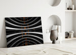Close-up detail of glowing orange lights piercing curved monochrome balconies