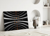 Close-up detail of glowing orange lights piercing curved monochrome balconies