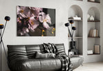 Macro Flower glass wall art styled above a bed in an intimate bedroom