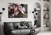 Macro Flower glass wall art styled above a bed in an intimate bedroom