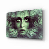 Tropical Leaf and Woman Portrait glass wall art displayed above a console in a designer interior