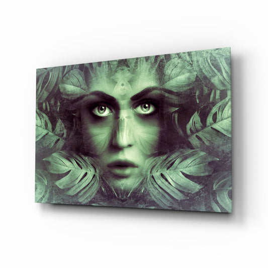 Tropical Leaf and Woman Portrait glass wall art displayed above a console in a designer interior