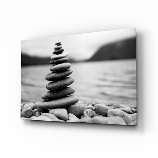 Pebbles glass wall art displayed above a console in a designer interior