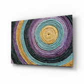 Colored Spiral glass wall art displayed above a console in a designer interior