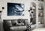 Smoke glass wall art styled above a desk in a contemplative study