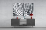 Leaf panel catching soft light to reveal its luminous spine