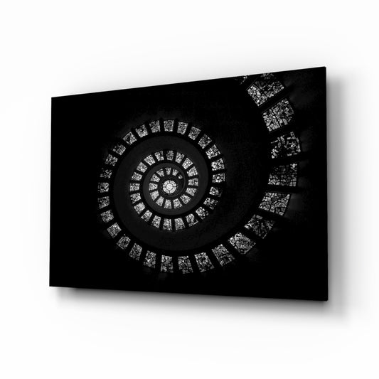 Spiral Stairs glass wall art displayed above a console in a designer interior