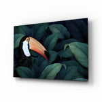 Toucan Parrot glass wall art displayed above a console in a designer interior