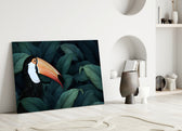 Close-up detail of toucan's orange beak among deep teal jungle leaves