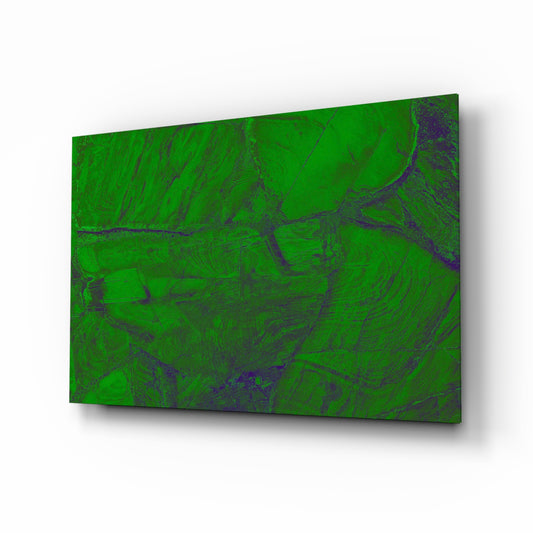 Green Abstract Pattern glass wall art displayed above a console in a designer interior