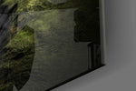 Green Valley artwork anchoring an alpine-themed wall in moody palette