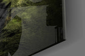 Green Valley artwork anchoring an alpine-themed wall in moody palette