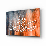 Calligraphy glass wall art displayed above a console in a designer interior