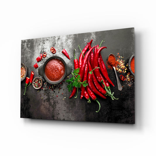 Red Peppers glass wall art displayed above a console in a designer interior