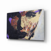 Women's glass wall art displayed above a console in a designer interior