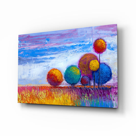 Colorful Trees glass wall art displayed above a console in a designer interior
