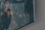 Forest artwork anchoring a biophilic-themed wall in moody palette