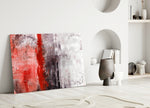 Close-up detail of crimson pigment meeting cream and black weathered field