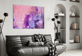 Abstract glass wall art styled above a bed in an intimate bedroom
