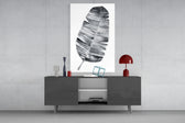 Feather panel catching soft light to reveal its watercolor wash