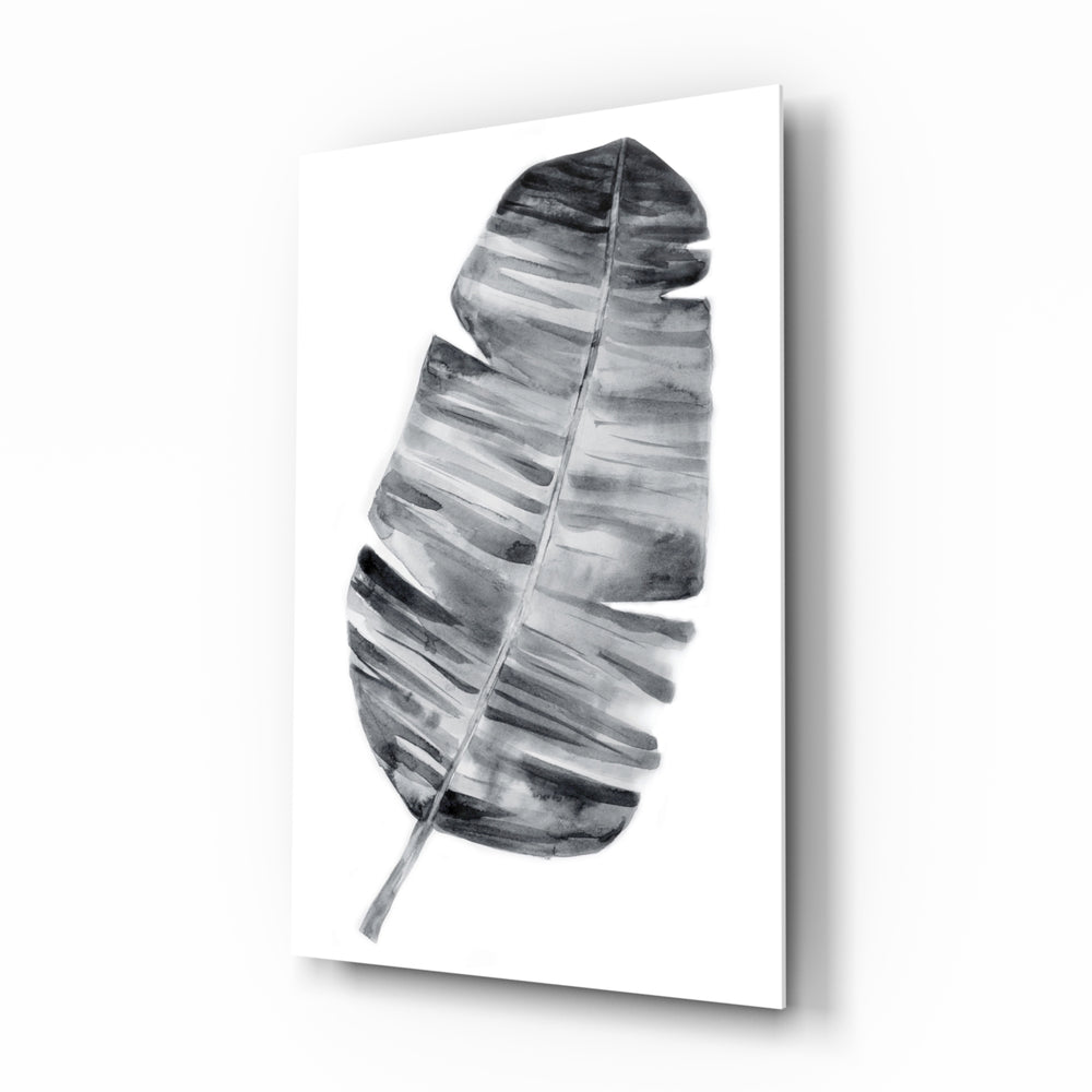 Feather glass wall art displayed above a console in a designer interior
