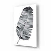 Feather glass wall art displayed above a console in a designer interior
