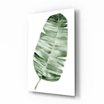 Feather glass wall art displayed above a console in a designer interior