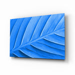 Blue Leaf glass wall art displayed above a console in a designer interior