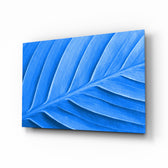 Blue Leaf glass wall art displayed above a console in a designer interior