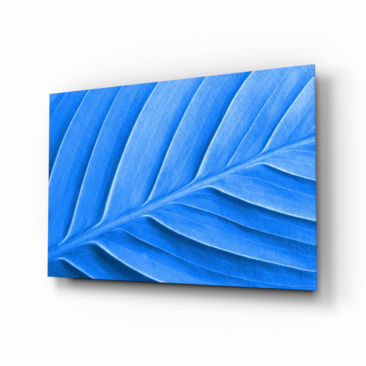 Blue Leaf glass wall art displayed above a console in a designer interior