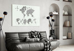 Continents glass wall art styled above a desk in a travel-mood study