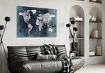 World Map glass wall art styled above a desk in a travel-mood study