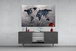 World Map panel catching soft light to reveal its plaster grain