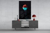 Apple panel catching gallery light to reveal its dripping ribbons