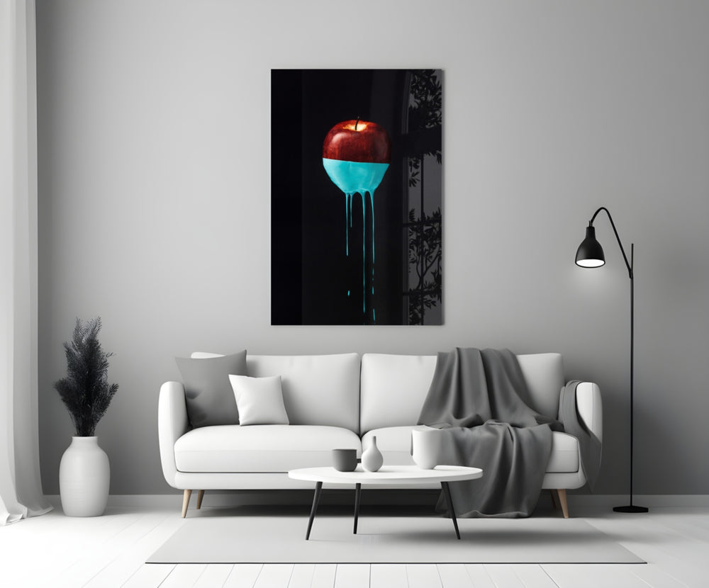 Close-up detail of crimson apple submerged in glossy turquoise paint