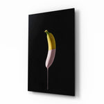Banana glass wall art displayed above a console in a designer interior