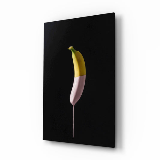 Banana glass wall art displayed above a console in a designer interior