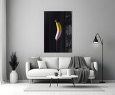 Close-up detail of yellow banana dipped in soft pink paint
