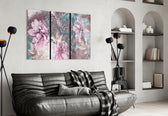 Flowers glass wall art styled above a bed in a serene bedroom