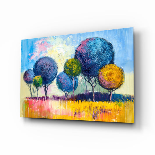 Trees glass wall art displayed above a console in a designer interior