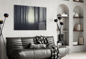 Foggy Forest glass wall art styled above a desk in an introspective study