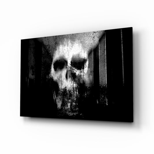 Skull glass wall art displayed above a console in a designer interior