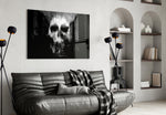Skull glass wall art styled above a desk in a gothic-mood study