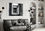 Shadow in the Dark glass wall art styled above a desk in an introspective study