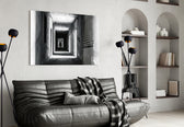 Shadow in the Dark glass wall art styled above a desk in an introspective study