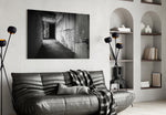 Hallway glass wall art styled above a desk in an introspective study
