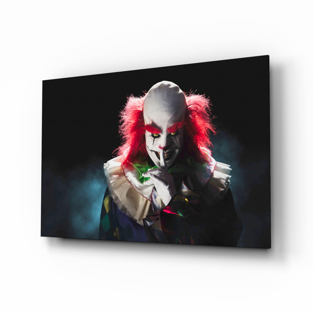 Clown glass wall art displayed above a console in a designer interior