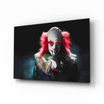 Clown glass wall art displayed above a console in a designer interior