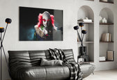 Clown glass wall art styled above a console in a horror-fan man-cave